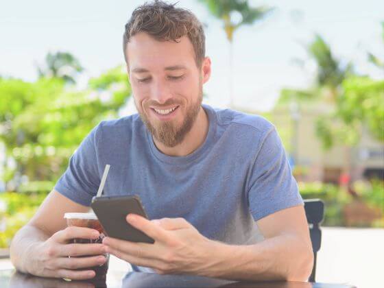 Man receiving MMS competition messages