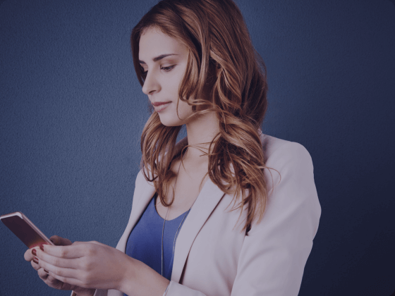 The woman in this picture is looking a form she received with her SMS message.