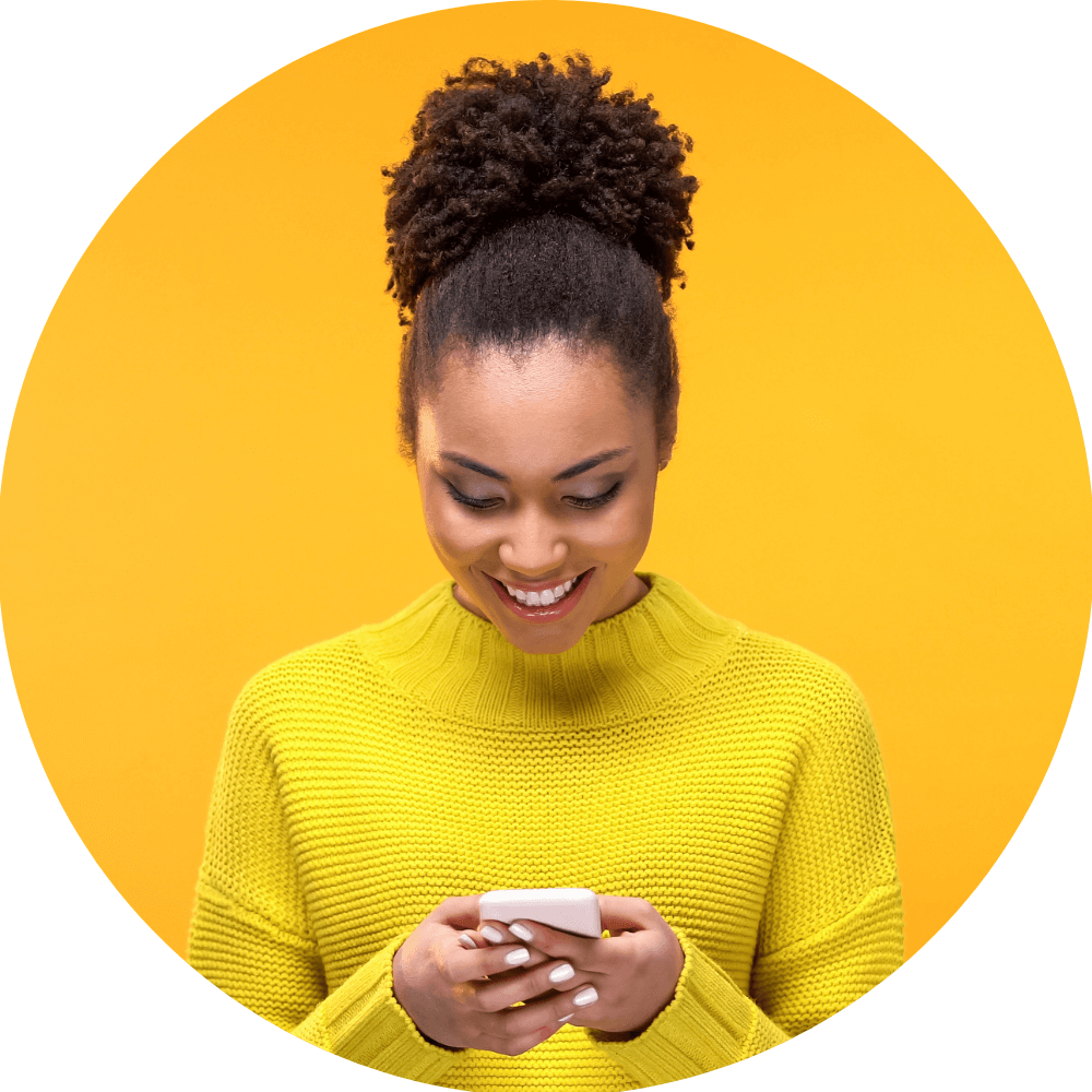 Woman reading a SMS message received with a mobile landing page.