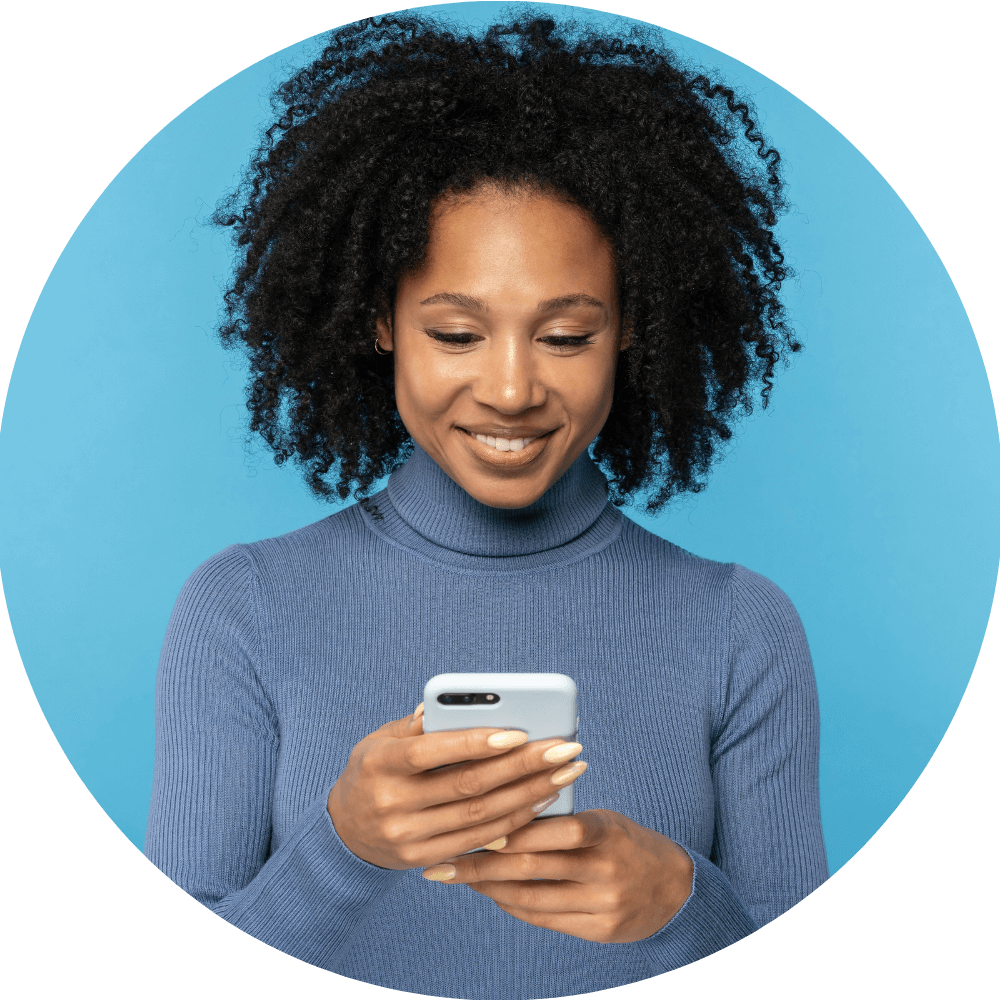 The woman in this image is filling a survey she received with her SMS message