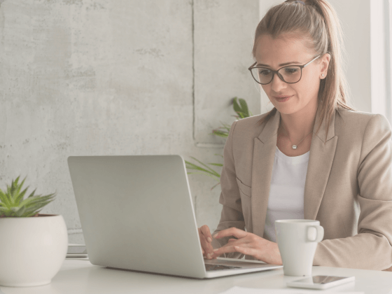 In this image a professional woman is reading the video with SMS blog
