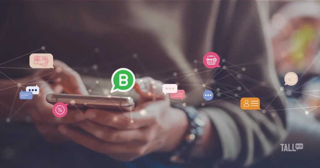 Person using a smartphone with floating icons representing messaging, loyalty, shopping, and customer engagement, highlighting business messaging connections.