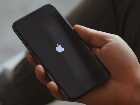A hand holding an iPhone.