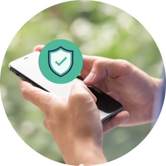 A paid of hands tapping into a mobile phone with a verified icon floating above the screen.